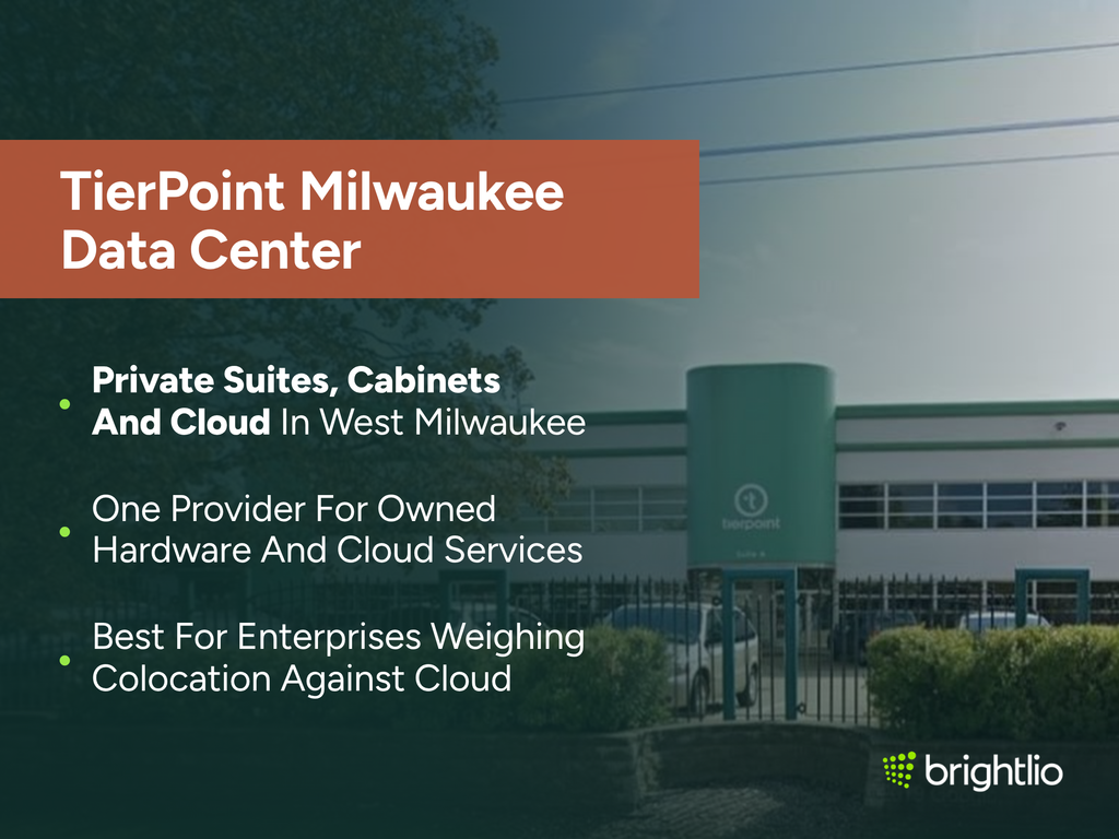 TierPoint Milwaukee Data Center graphic over a photo of the TierPoint facility at 3701 West Burnham Street in West Milwaukee, showing its low white and teal-green building with a rounded entrance tower carrying the TierPoint logo, ribbon windows along the upper floor, a black security fence with clipped hedges and parked cars behind it, beneath a dark teal overlay, highlighting private suites, cabinets and cloud in West Milwaukee, one provider for owned hardware and cloud services, and suitability for enterprises weighing colocation against cloud, with the Brightlio logo.