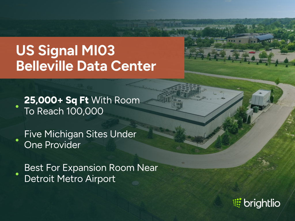 US Signal MI03 Belleville Data Center graphic over an aerial photo of the single-storey facility on Haggerty Road in Belleville, Michigan, showing its white flat roof lined with cooling units, a dark banded exterior, an outdoor chiller unit at one end, a fenced lawn with young conifers, a service road and parking lot, beneath a dark teal overlay, highlighting 25,000+ sq ft with room to reach 100,000, five Michigan sites under one provider, and suitability for expansion room near Detroit Metro Airport, with the Brightlio logo.